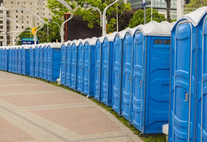 a row of portable restrooms at a fairground, offering visitors a clean and hassle-free experience in gallup